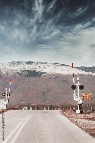 Road in greek mountains at Edessa territory with snow in the mountains and dead nature from the cold 