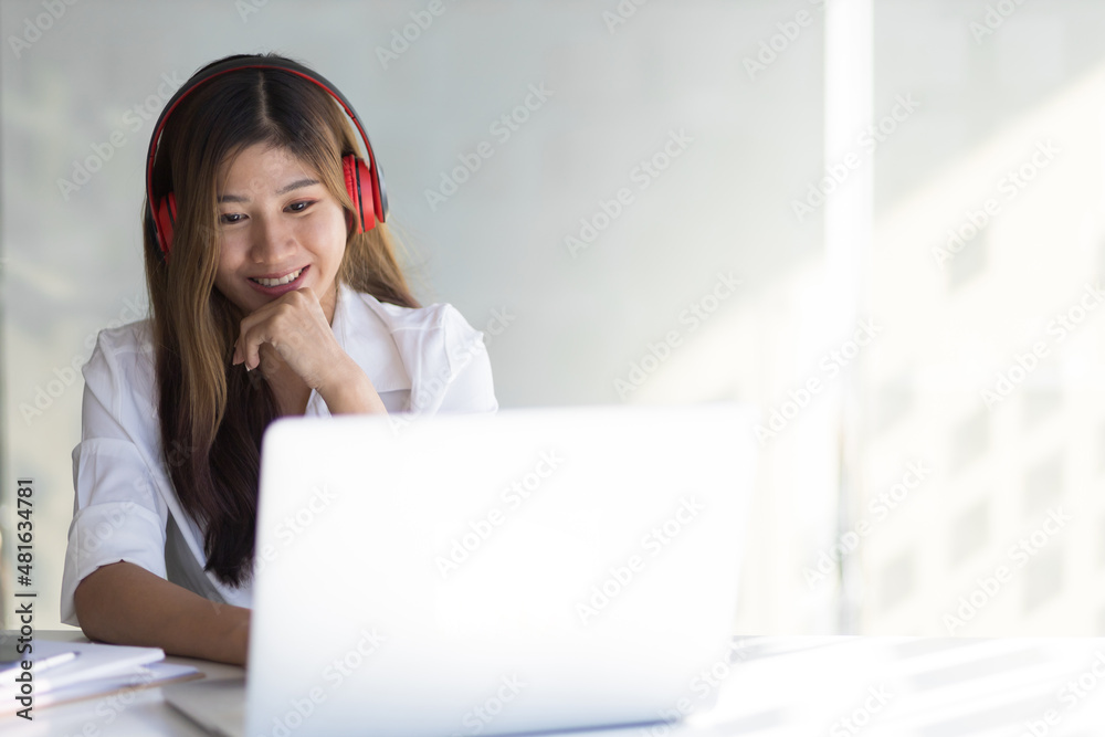 Happy smiling woman working and studying online from laptop. Happy smiling woman working and studying online from laptop.