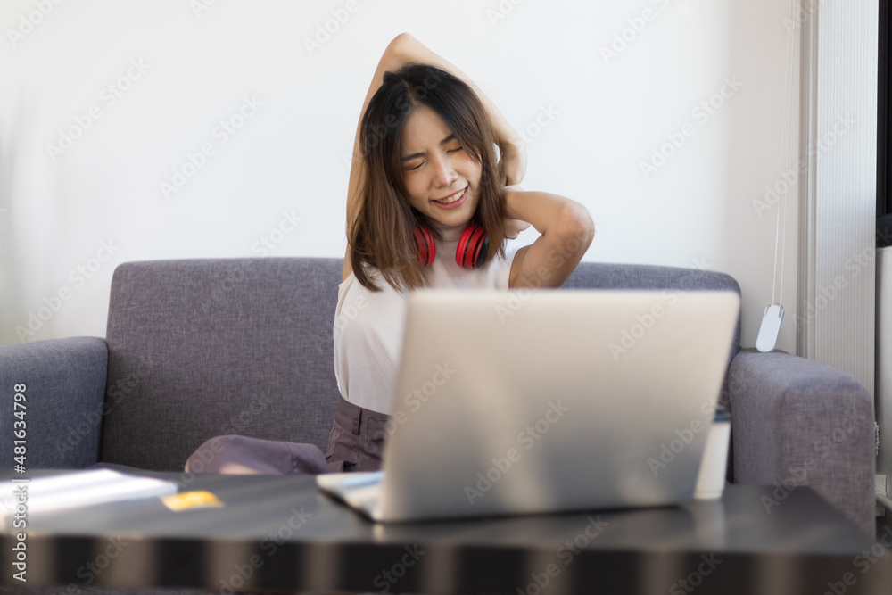 Woman doing stretches to relax from work at home. Work from home and social distancing concept for quarantine. Woman doing stretches to relax from work at home. Work from home and social distancing concept for quarantine.