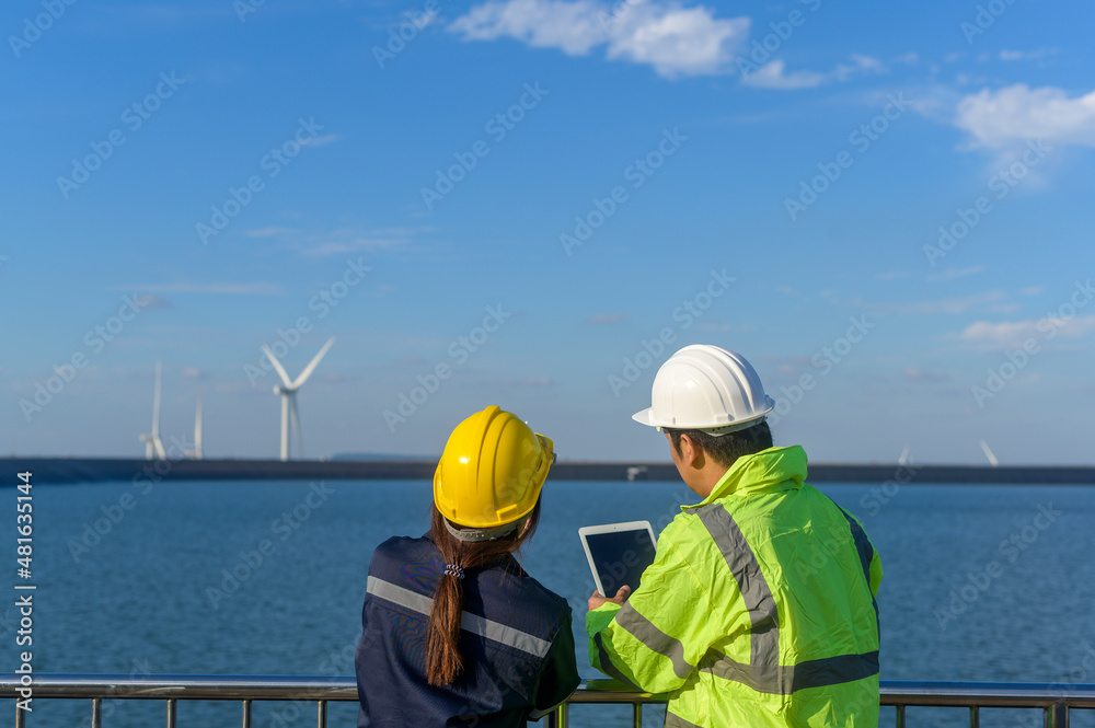 people engineer are wearing a protective helmet on head, using tablet Analytics engineering data... people engineer are wearing a protective helmet on head, using tablet Analytics engineering data...