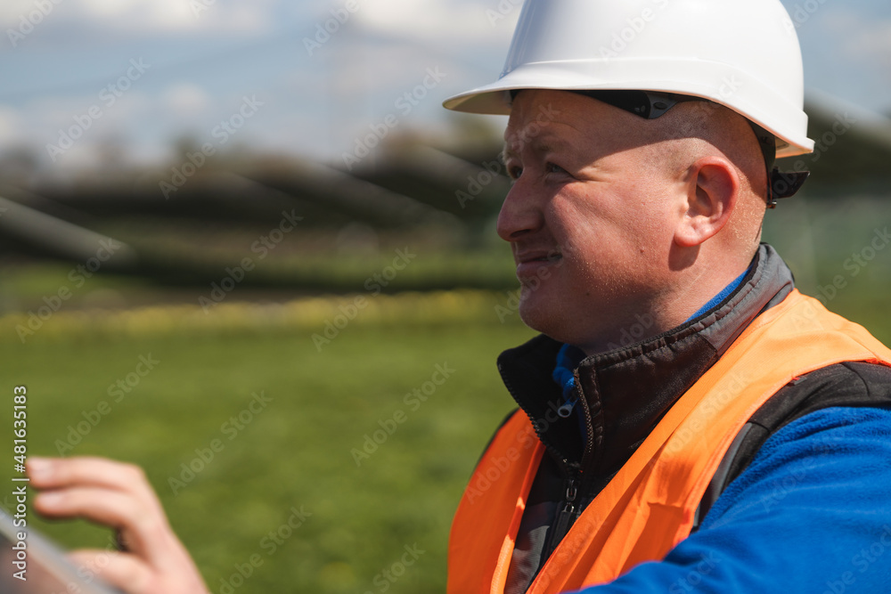 Close-up portrait of electrician engineer in a hard hat Close-up portrait of electrician engineer in a hard hat