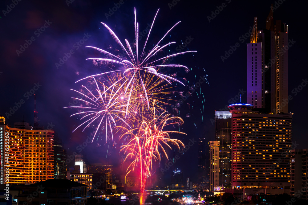 colourful firework celebrate of Festival with night light bangkok cityscape background bangkok city, Thailand.