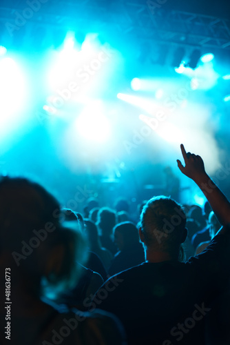 Are you ready to rock. Shot of a fans watching a live concert.