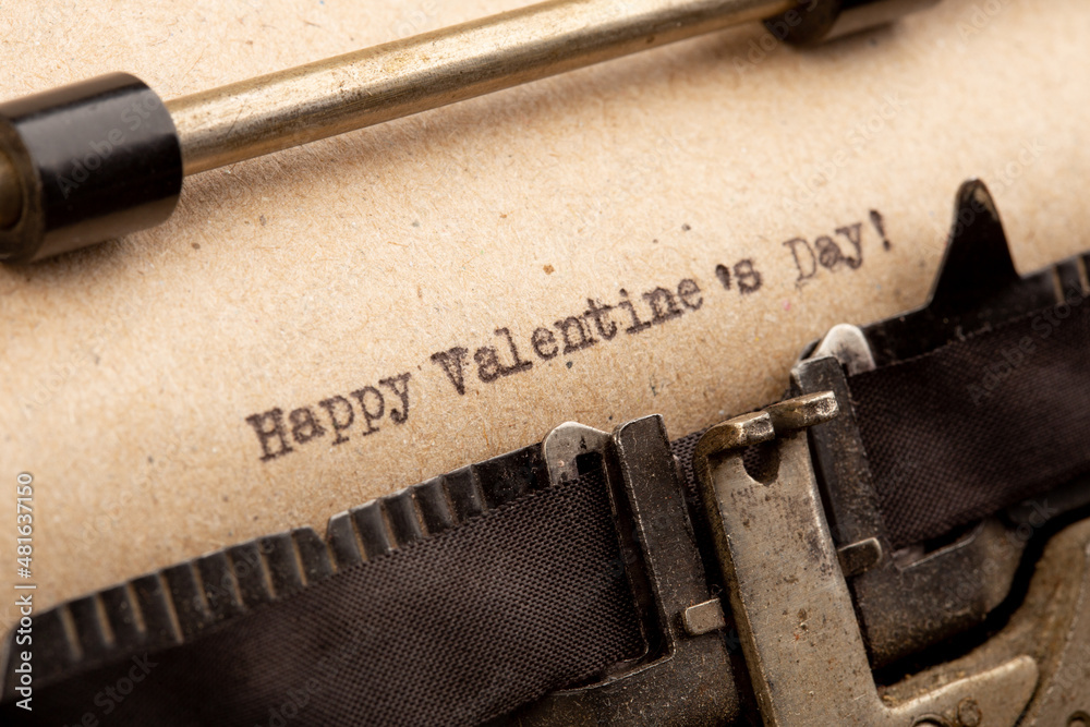 Happy Valentine`s day - phrase on typewriter. Valentines Day greetings concept. Valentines greeting card.