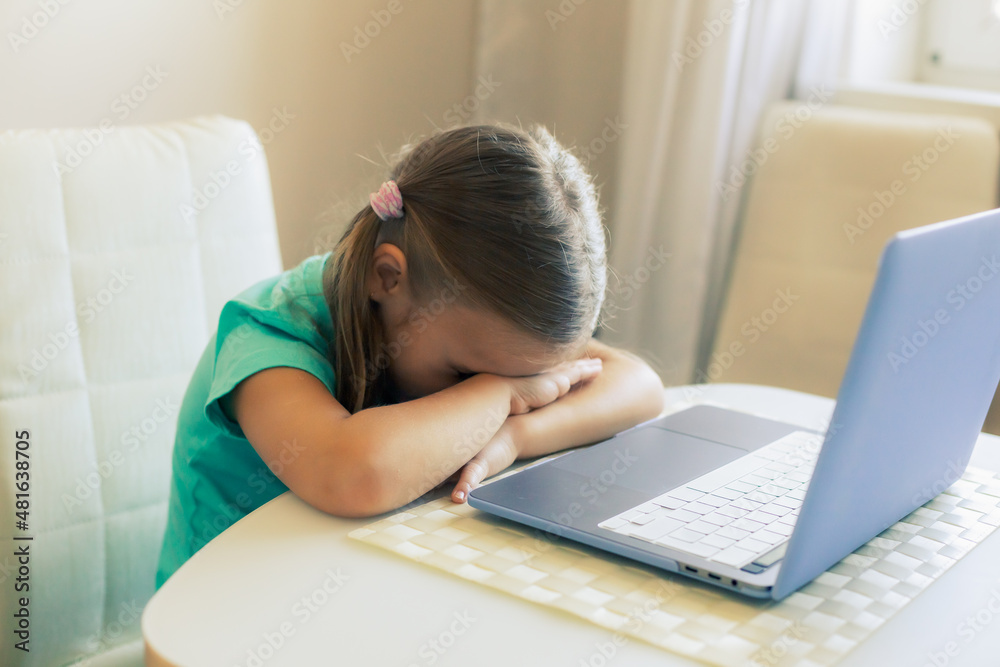 Little cute girl uses laptop to have video call