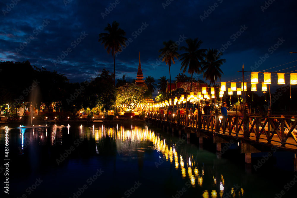 Sukhothai, Thailand - December 31, 2021: view morning scenery  of Wat Tra Phang Thong Temple, Sukhothai,Thailand. the buddishts with Alms Giving Ceremony