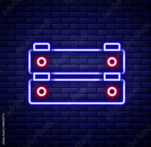 Glowing neon line Wooden box icon isolated on brick wall background. Grocery basket, storehouse crate. Empty wooden container for vegetables, products. Colorful outline concept. Vector