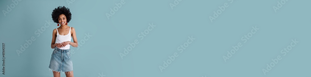 Happy african american girl smiling and looking at camera Happy african american girl smiling and looking at camera