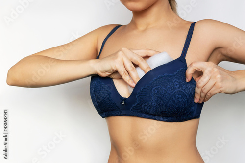 Cropped shot of a young woman putting in bra inserts for visual breast enlargement 