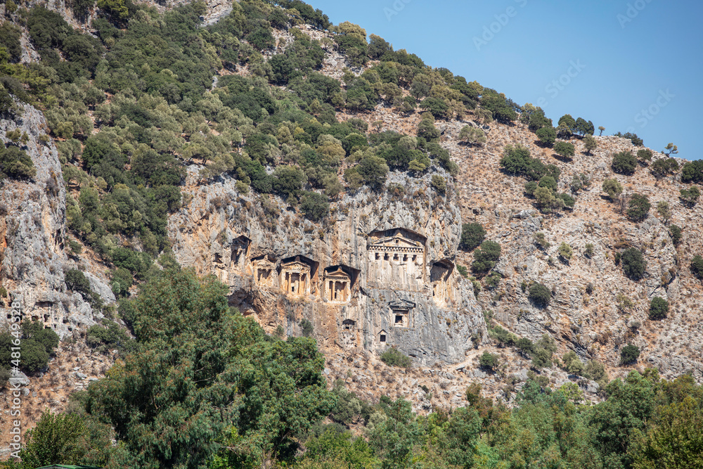 Fototapeta premium Rock-cut temple tombs in Kaunos Dalyan - Turkey (Turkish name; kaya mezarlari) Ancient city of Kaunos, Dalyan valley, Turkey. Kaunos (Latin: Caunus) was a city of ancient Caria and in Anatolia