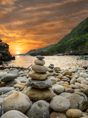 Photography Pile of stones stacked on a beach in the storm river mouth in the Tsitsikamma na