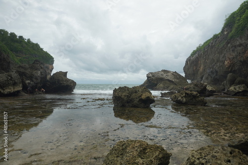 beach with rocks and calm water