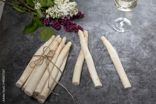 Bunch of fresh white asparagus on a stone table