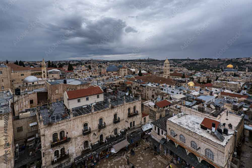 Top view of Jerusalem roofs under stormy sky