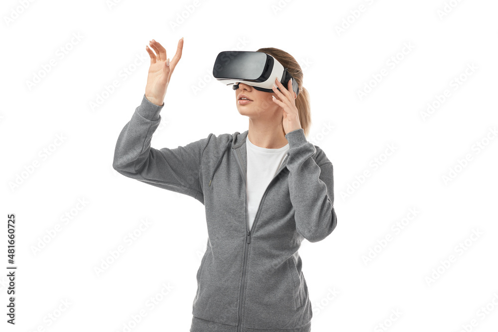 Woman in VR goggles interacting with virtual realty Woman in VR goggles interacting with virtual realty