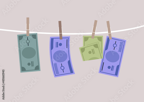 Banknote bills drying pinned on a clothesline, a money laundry concept
