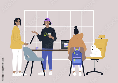A diverse team of young adults working in the office, millenials at work