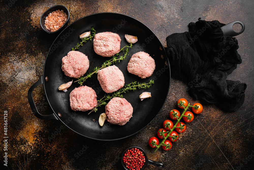 Semi-finished products, raw meatball, on old dark rustic table background, top view flat lay