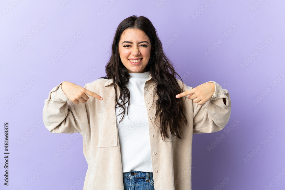 Young caucasian woman isolated on purple background proud and self-satisfied