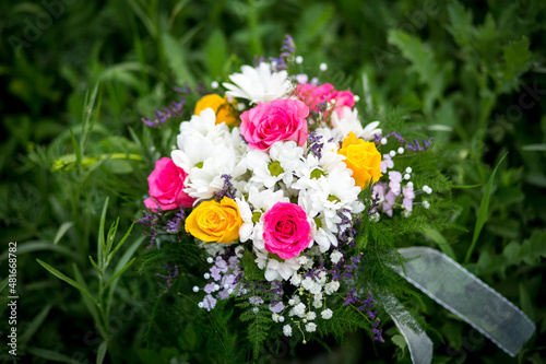 
Bouquet of flowers from roses and daisies, flowers for the day of everything, wedding bouquet, flowers for the bride, wedding accessories.