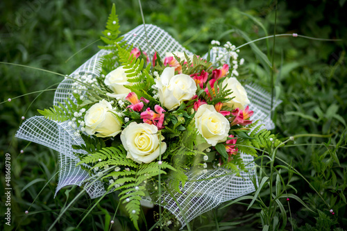 
Bouquet of flowers from roses and daisies, flowers for the day of everything, wedding bouquet, flowers for the bride, wedding accessories.