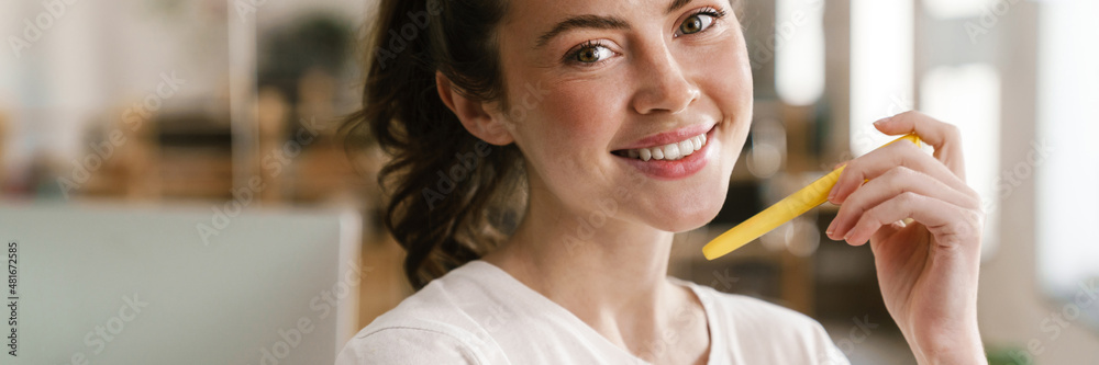 Close up of a young brunette woman casually dressed Close up of a young brunette woman casually dressed