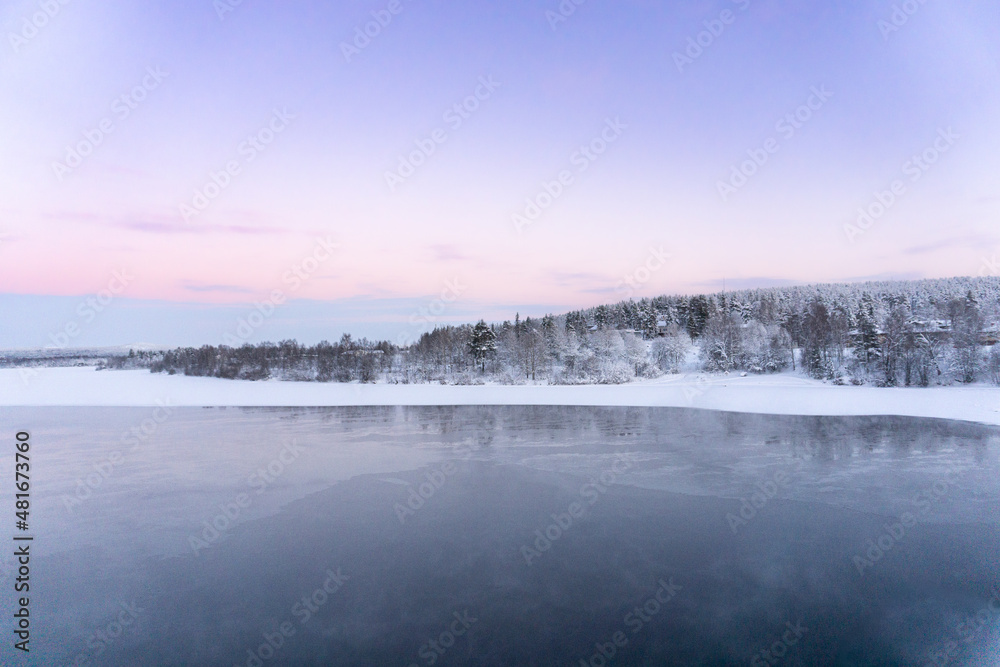 Winter landscape, panorama, banner - view of the frozen river in Lapland Winter landscape, panorama, banner - view of the frozen river in Lapland