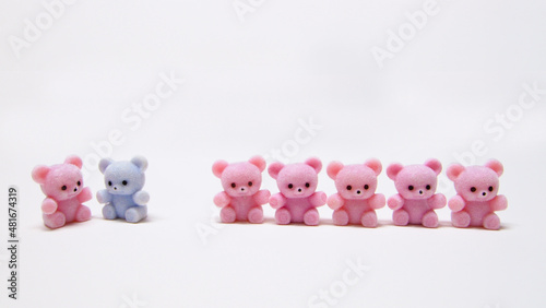 Miniature cute teddy bears in a row