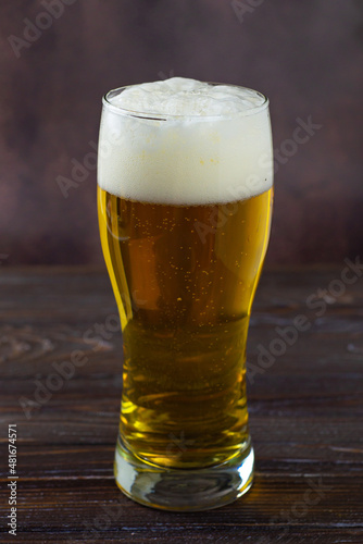 beer in a glass on a dark background