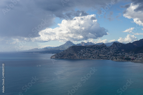 scenic rain clouds over the mediterranean sea and mountains near the coast 