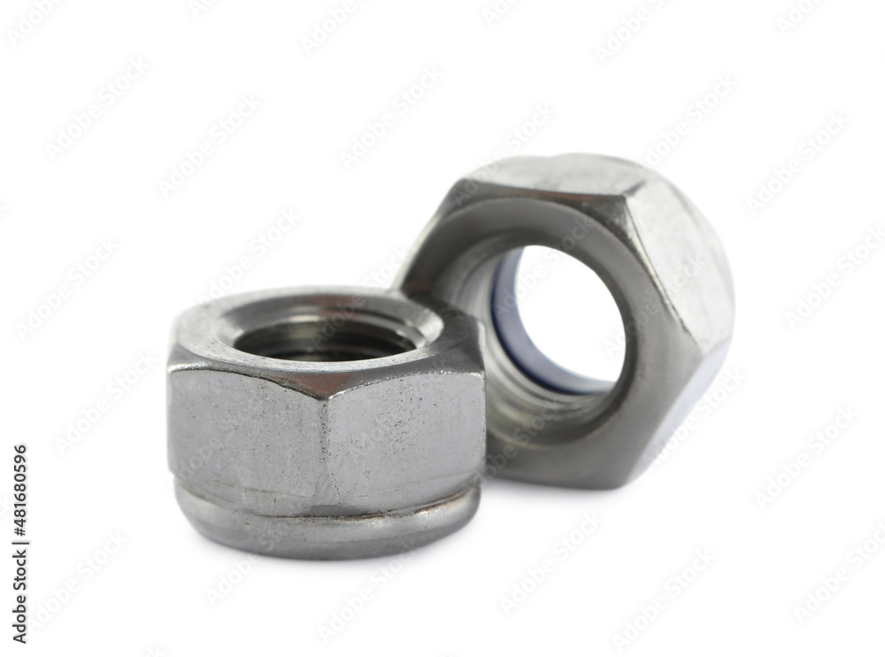 Two metal nyloc nuts on white background Two metal nyloc nuts on white background