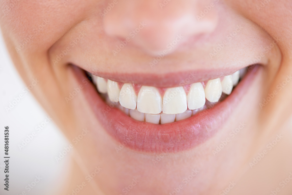Fototapeta premium Dazzling smile. Close up of a woman's sparkling teeth.