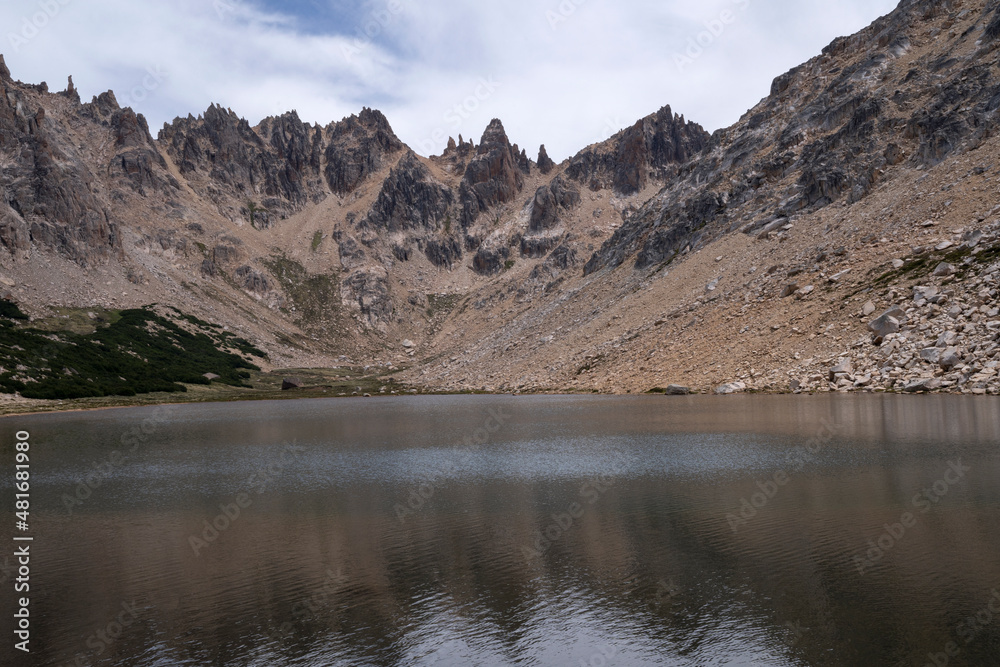 Alpine landscape. View of Toncek lake at the top of Catedral hill in Bariloche. The rocky mountains in the background. Alpine landscape. View of Toncek lake at the top of Catedral hill in Bariloche. The rocky mountains in the background.
