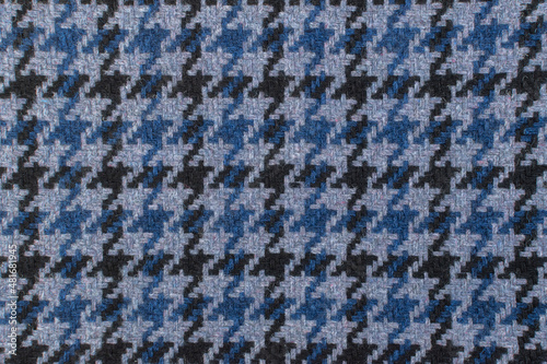 Classic tweed, Wool Background Texture. Coat close-up. Expensive men's suit fabric. Glenurquhart check is made of woolen fabric with a woven twill design of small and large checks. Houndstooth seamles