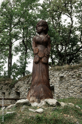 Wooden statue of Berticka girl, wife of Vitek at Vitkuv castle, Sumava mountains, Czech republic © Kristyna_Mladkova