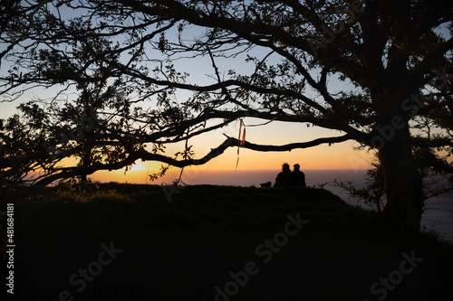 A couple enjoys the sunset from the Celtic fort of Santa Tecla in A Guarda