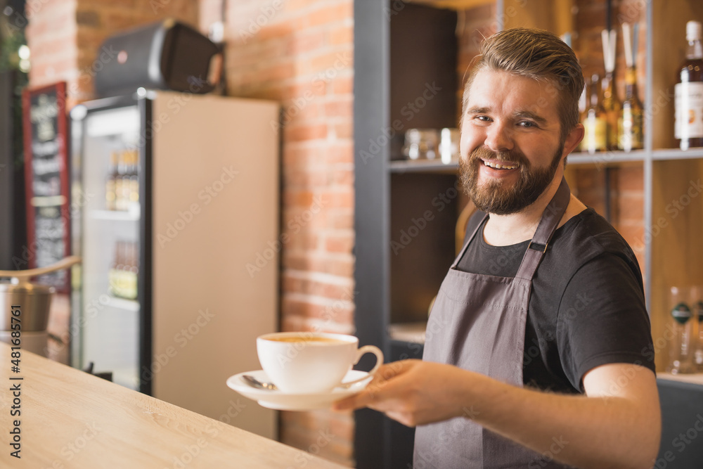 Barista with cup of coffee in cafe Barista with cup of coffee in cafe