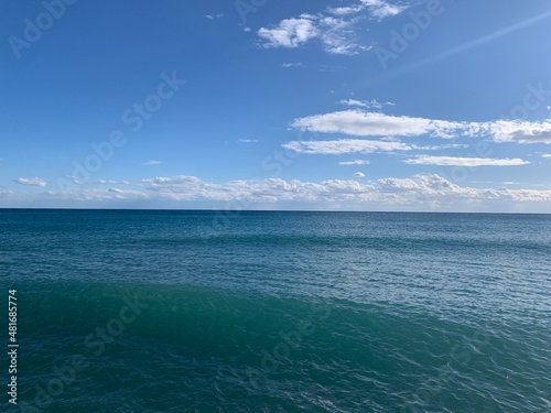 Perfect line of the sea horizon  deep blue sea surface and blue sky