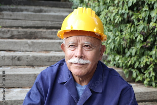 Senior man with a mustache doing construction work