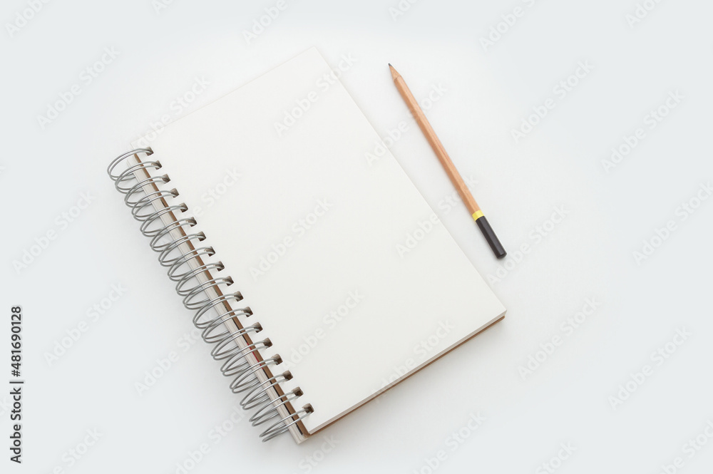 Blank wired sketch drawing pad with pencil on white background Blank wired sketch drawing pad with pencil on white background
