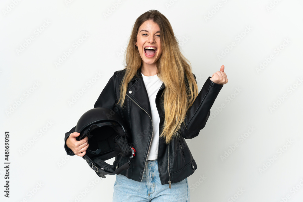 Woman holding a motorcycle helmet isolated on white background celebrating a victory in winner position Woman holding a motorcycle helmet isolated on white background celebrating a victory in winner position