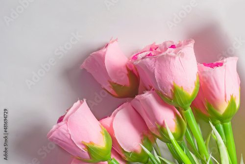 Fototapeta Naklejka Na Ścianę i Meble -  Valentine's Day background with bouquet of pink roses on white background.