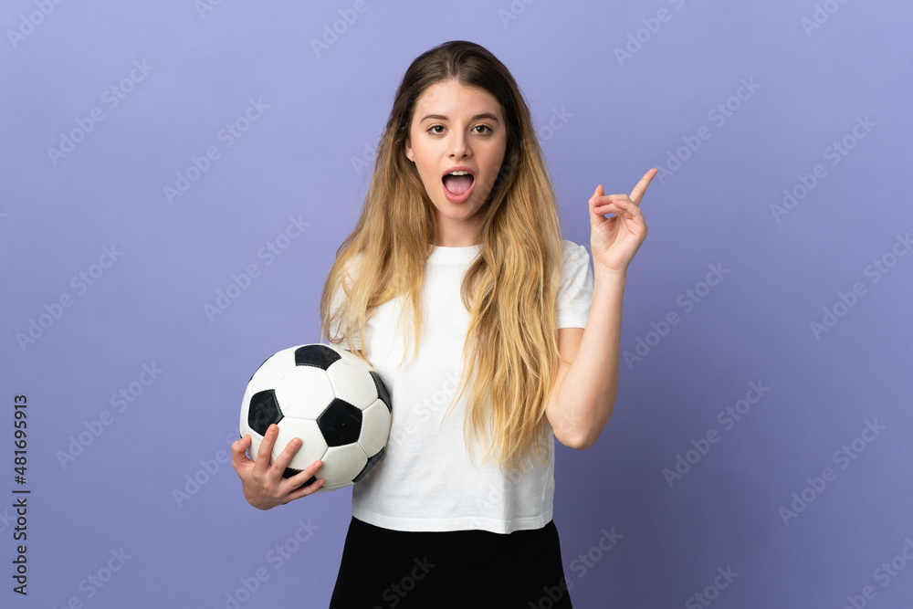 Young blonde football player woman isolated on purple background intending to realizes the solution while lifting a finger up Young blonde football player woman isolated on purple background intending to realizes the solution while lifting a finger up