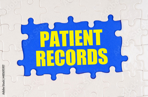 Inside the white puzzles on a blue background it is written - Patient records