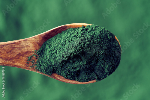 Spirulina bluegreen algae powder on a spoon photo