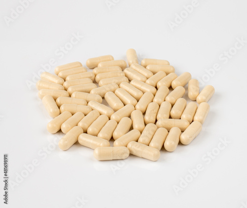 Gelatin capsules with drug on a light background