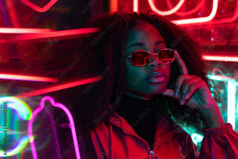 Gå rundt pastel spiselige Long hair girl with sunglasses and leather jacket looking at neon lights  Stock Photo | Adobe Stock