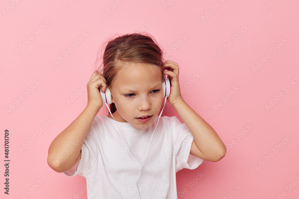 Portrait of happy smiling child girl smile posing headphones Lifestyle unaltered Portrait of happy smiling child girl smile posing headphones Lifestyle unaltered