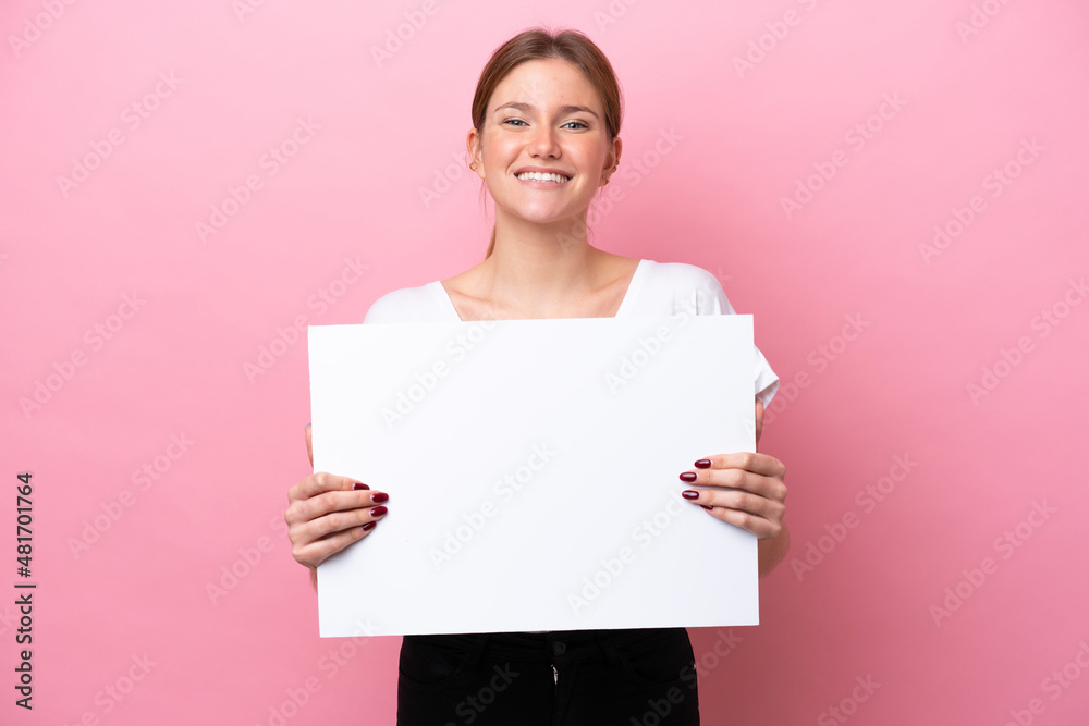Young caucasian woman isolated on pink background holding an empty placard with happy expression Young caucasian woman isolated on pink background holding an empty placard with happy expression