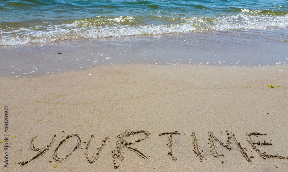 Handwriting word your time written in the sand Handwriting word your time written in the sand